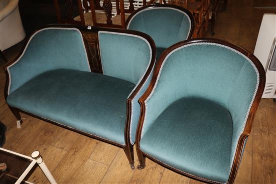 An Edwardian inlaid mahogany three piece boudoir settee